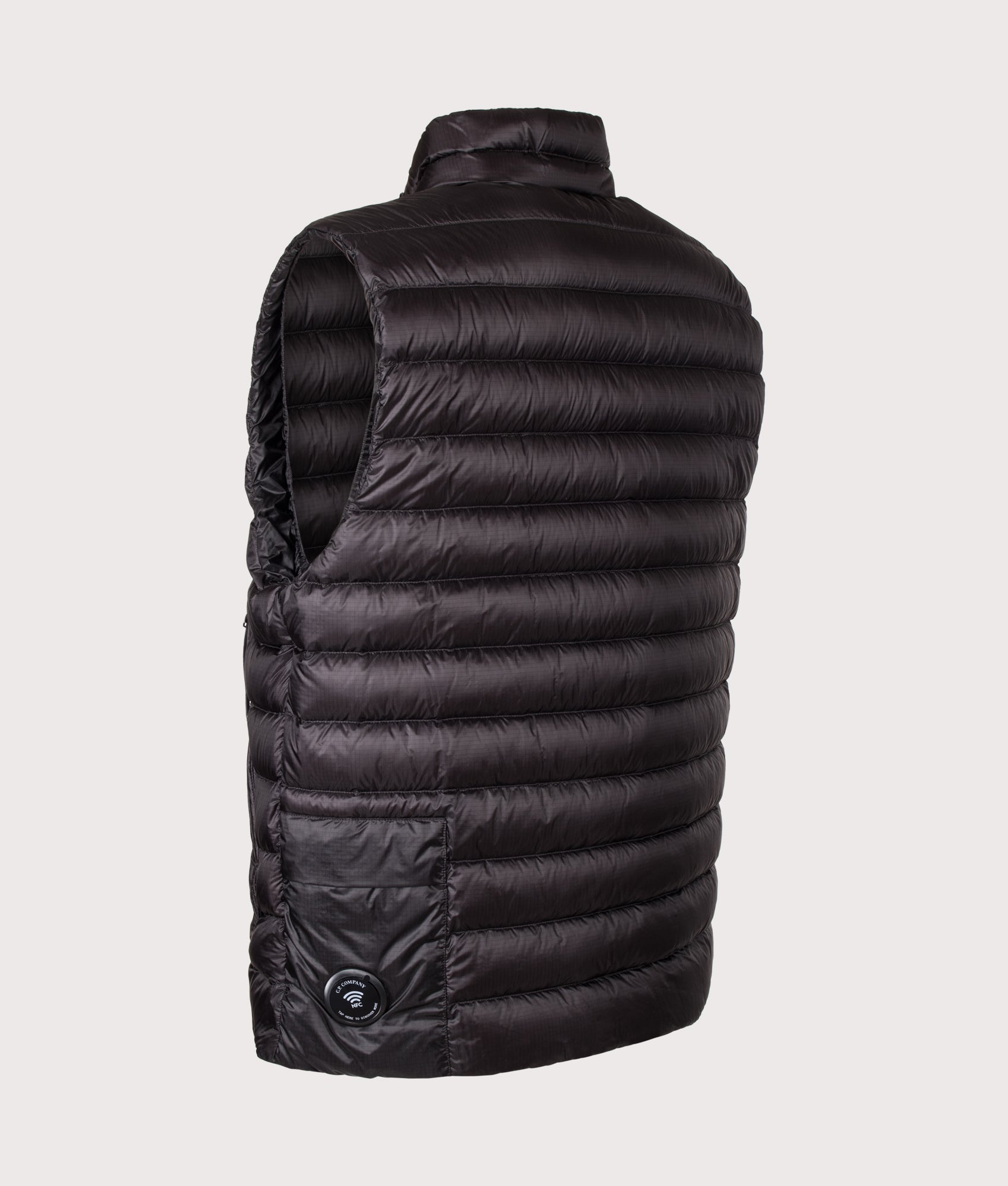 C.P. Company Dd-Shell Down Lens Gilet in Black at EQVVS Menswear. Angled back shot.