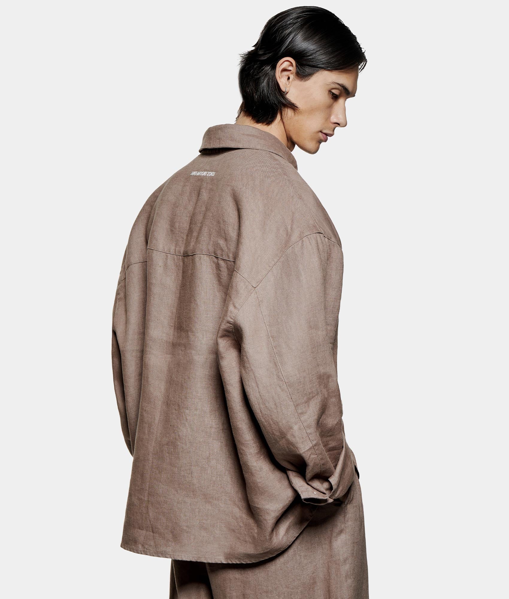 Linen Box Dress Shirt. Shot by EQVVS. Back angled model shot.