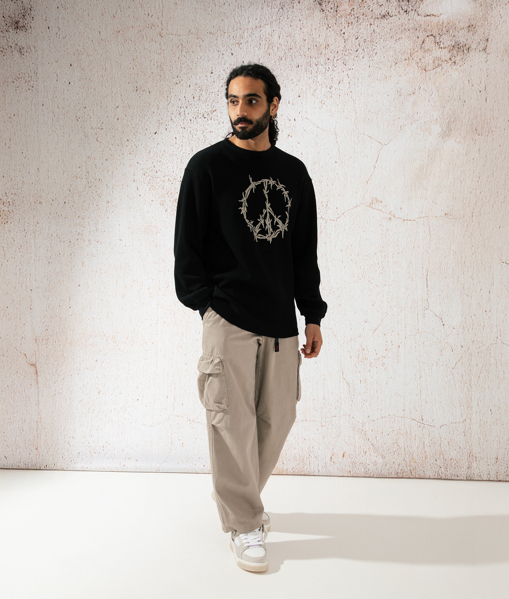 Aries Peace Press Gothic Waffle Long Sleeve T-Shirt in Black. campaign Shot at EQVVS.