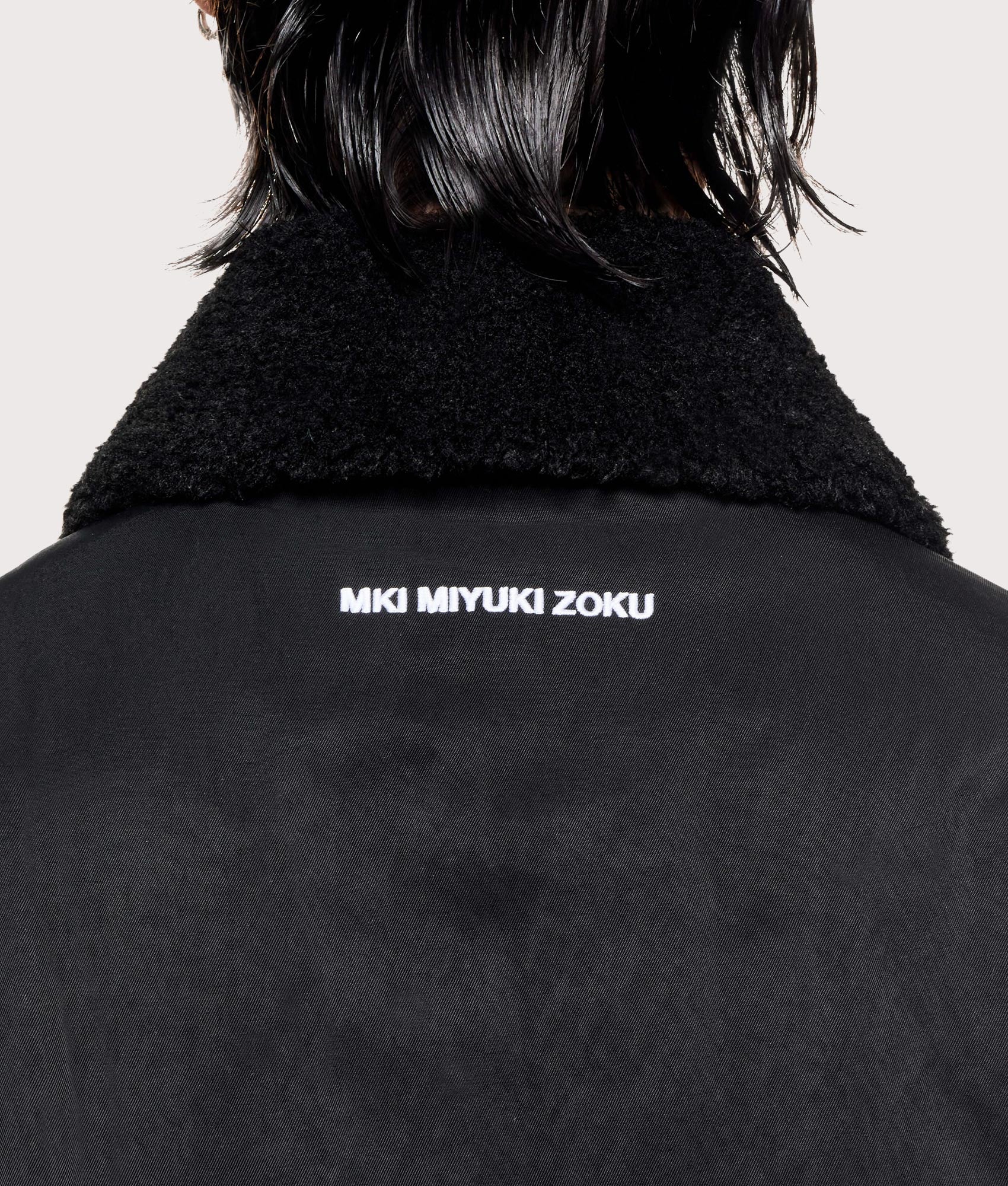 MKI MIYUKI ZOKU Padded Nylon Box Jacket in Black at EQVVS Menswear. Detail shot.