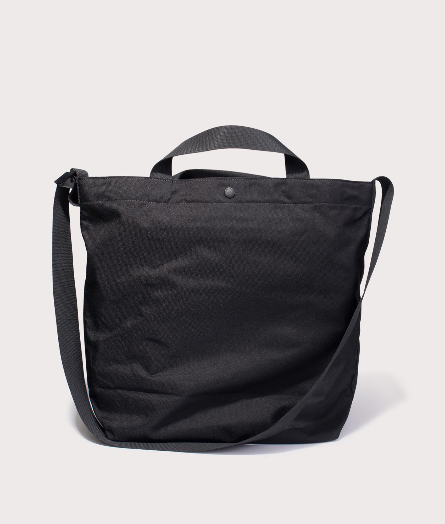 and wander Recycled OX Logo Tote Bag  in Black at EQVVS Menswear. Back shot.
