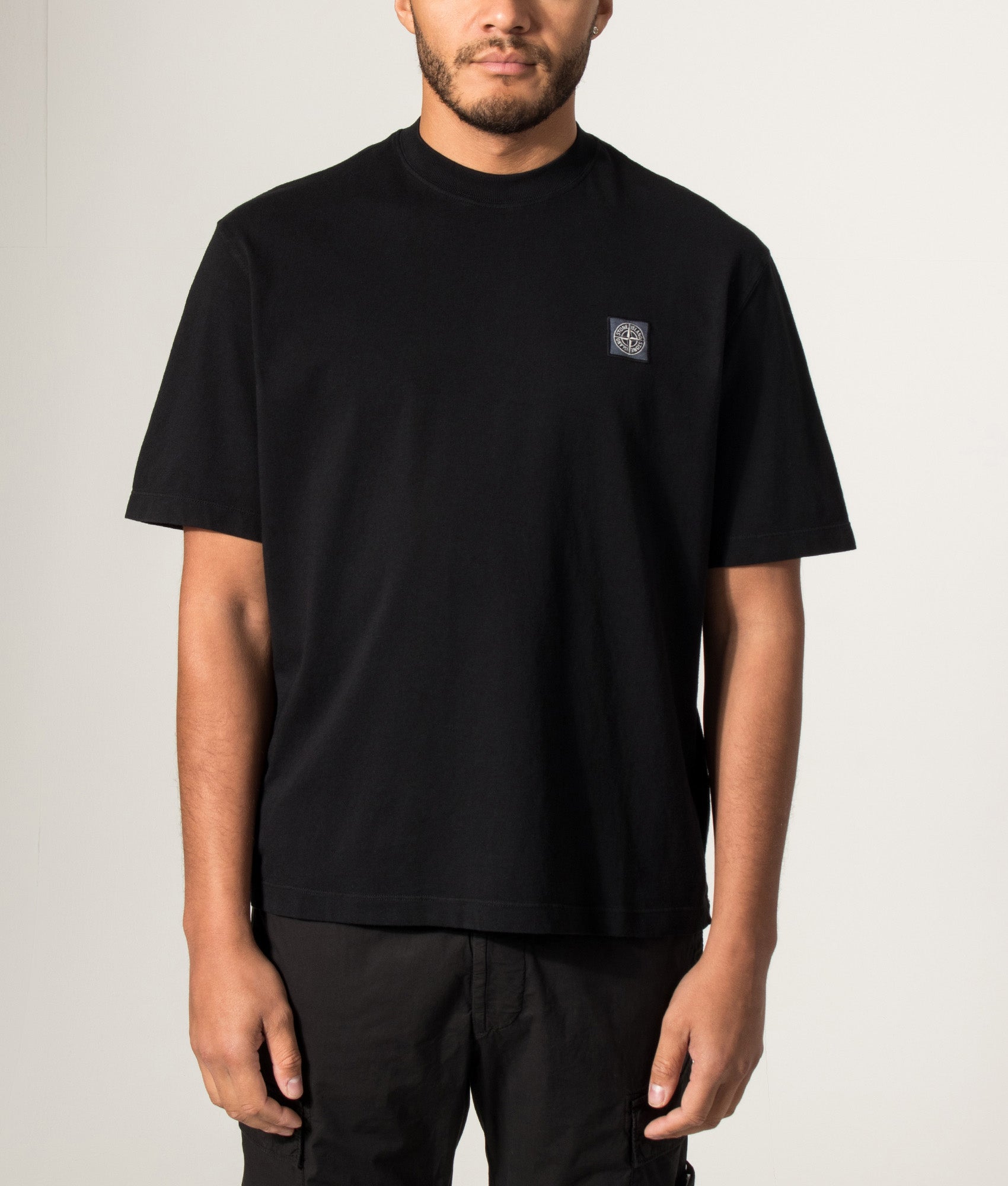 Stone Island Combed Organic Cotton Jersey T-Shirt in Black at EQVVS Menswear. Model front shot.