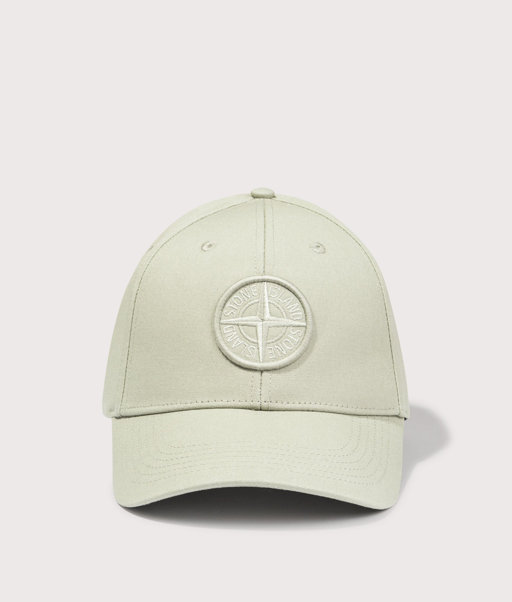 Compass Baseball Cap by Stone Island in Sage Green. Shot by EQVVS. Front shot.