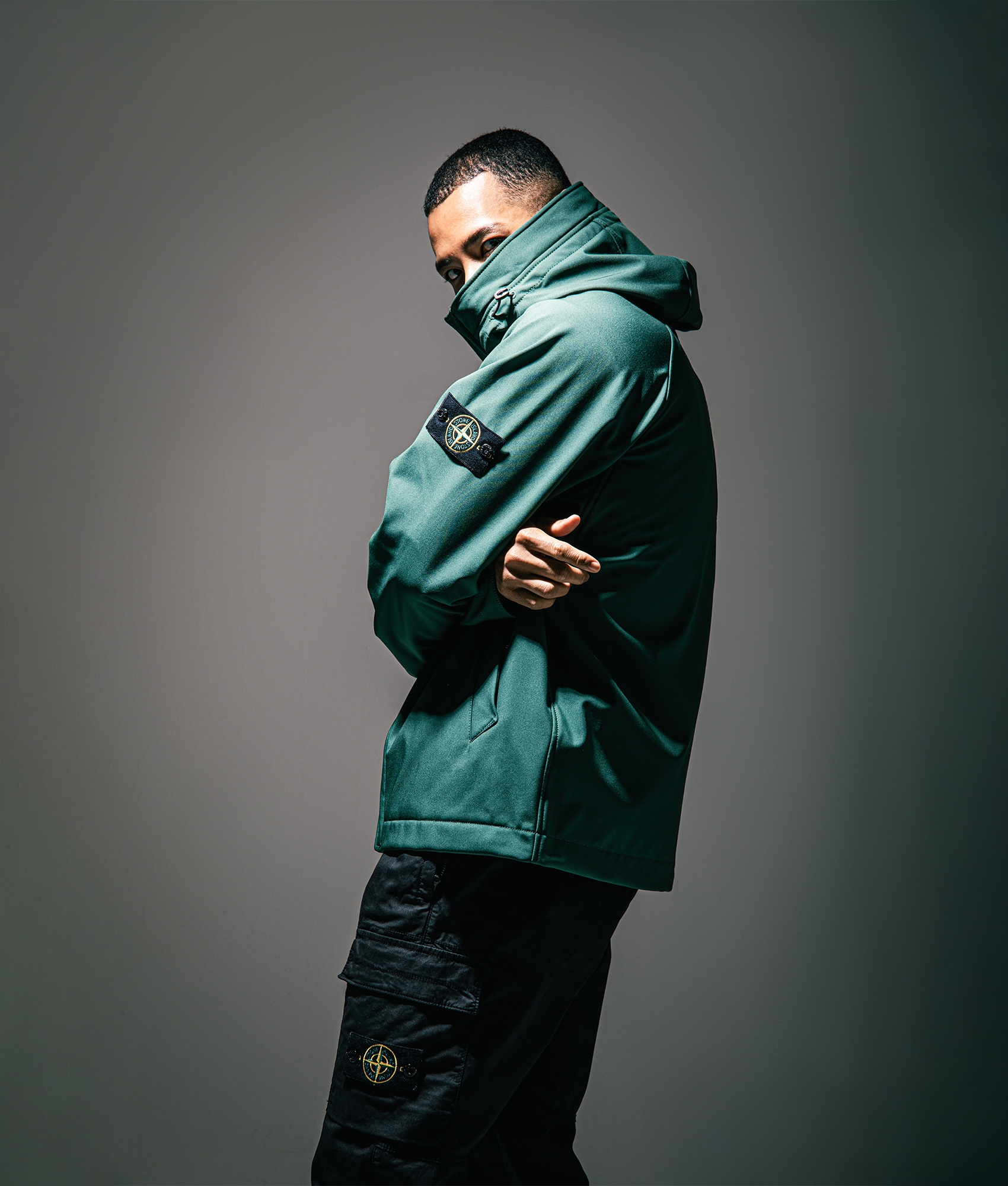 Stone Island Short Parka in Juniper at EQVVS Menswear. Campaign shot.