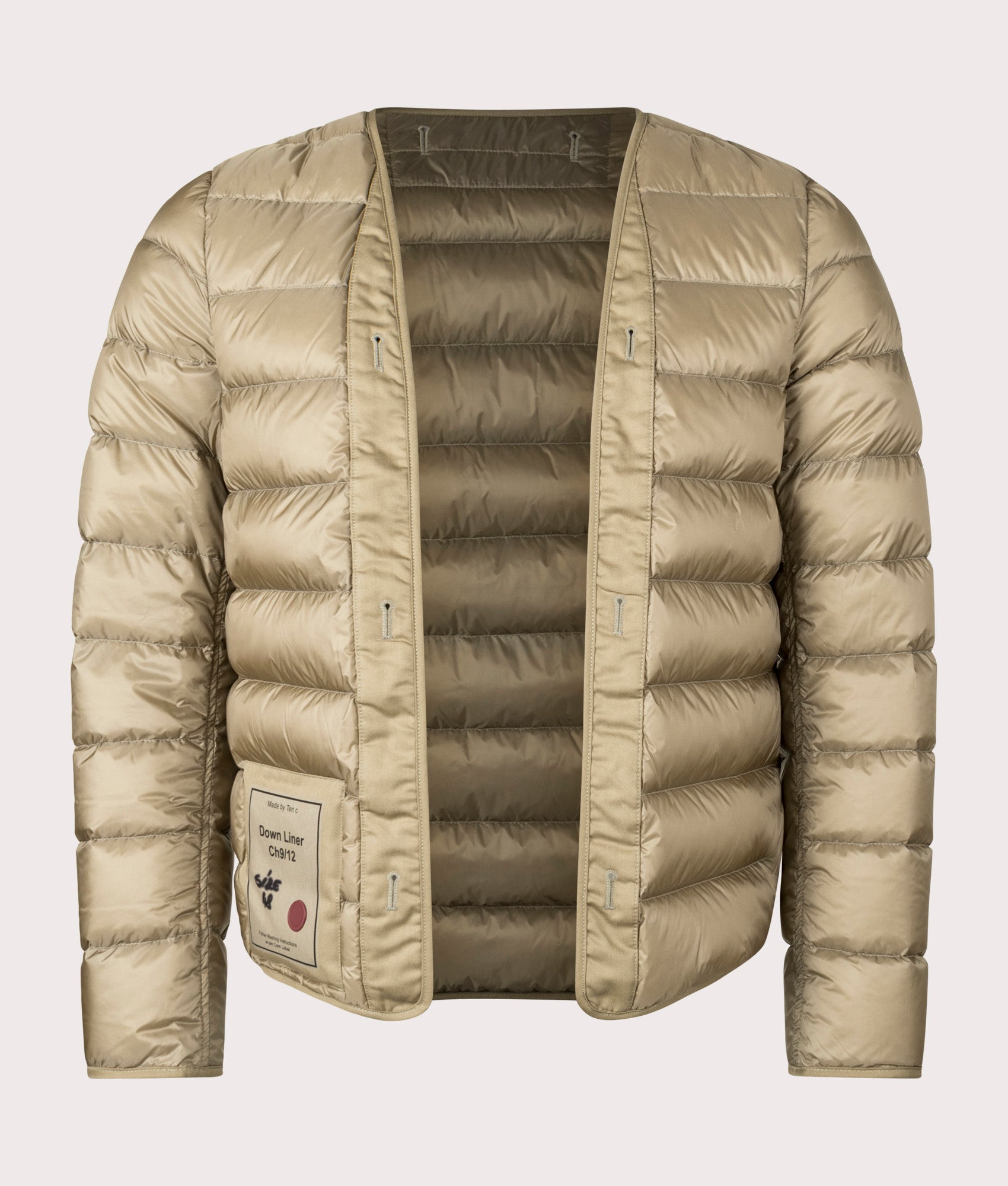 Down Liner Puffer Jacket by Ten c in Light Khaki. Shot by EQVVS. Front shot.
