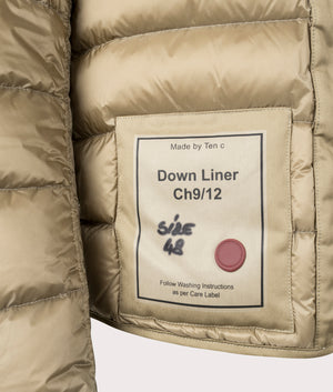 Down Liner Puffer Jacket by Ten c in Light Khaki. Shot by EQVVS. Detail shot.