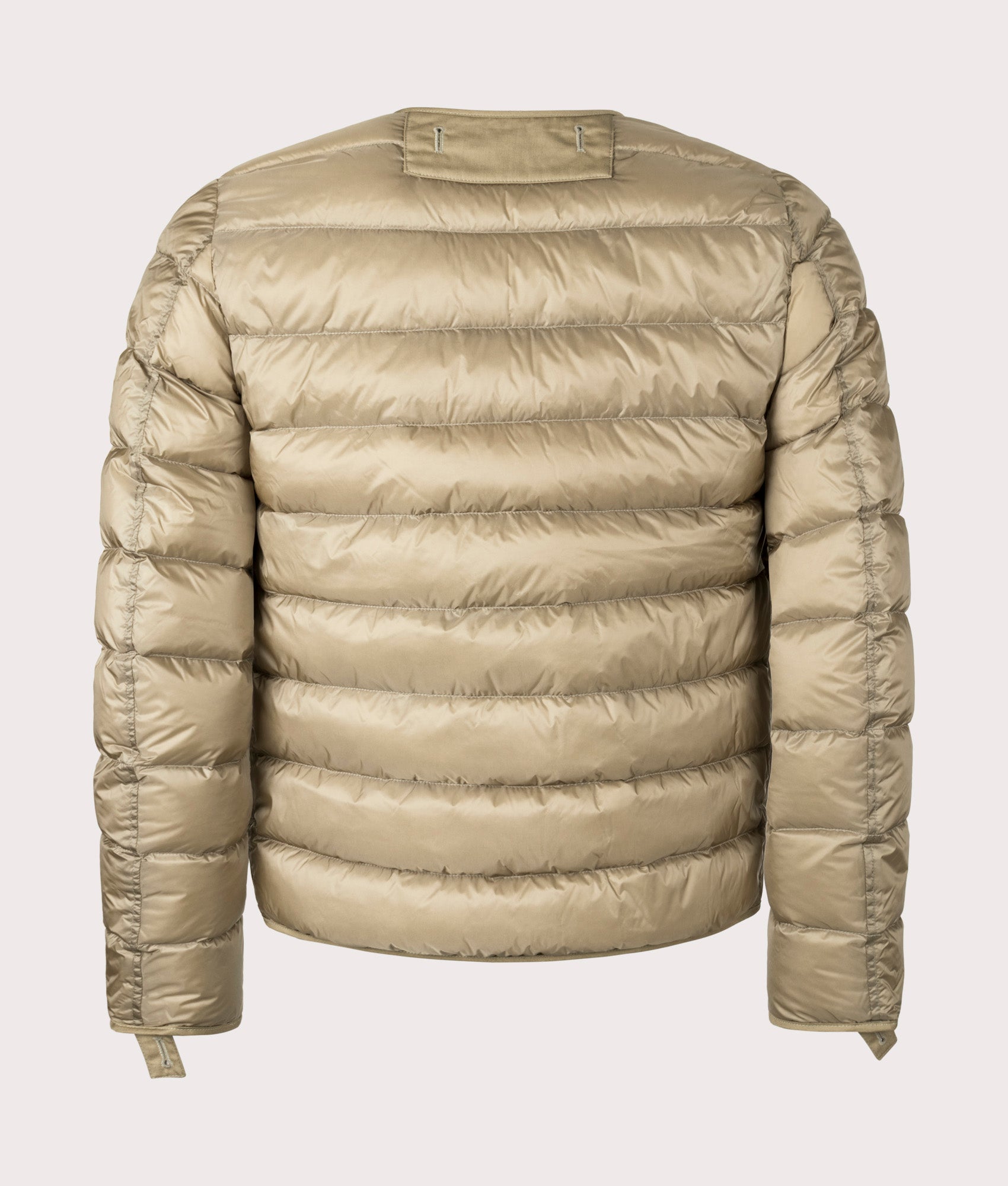 Down Liner Puffer Jacket by Ten c in Light Khaki. Shot by EQVVS. Back shot.