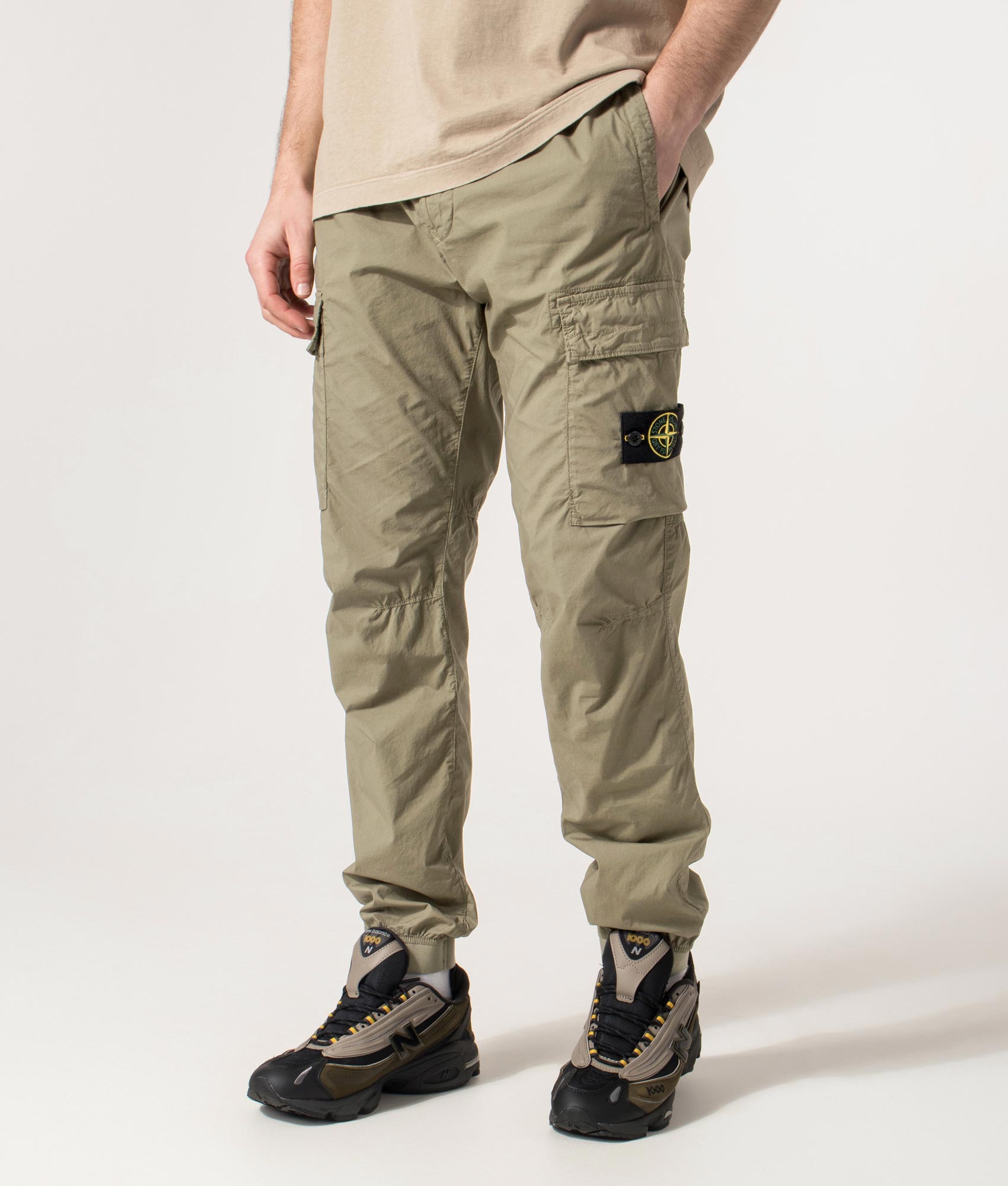 Regular Fit Tapered Cargo Pants in Military Green | Stone Island | EQVVS | Front angle model shot 