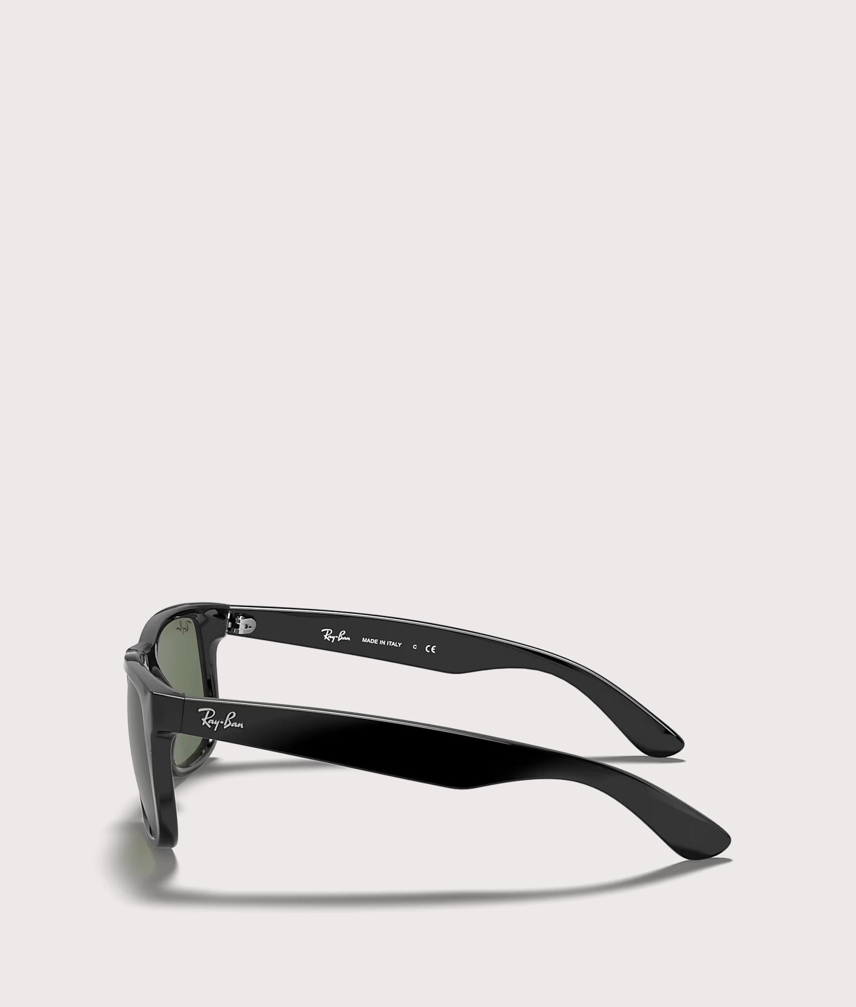 Justin Classic Sunglasses in Polished Black Dark Green Lenses by Ray-Ban. Shot by EQVVS. Side Shot.