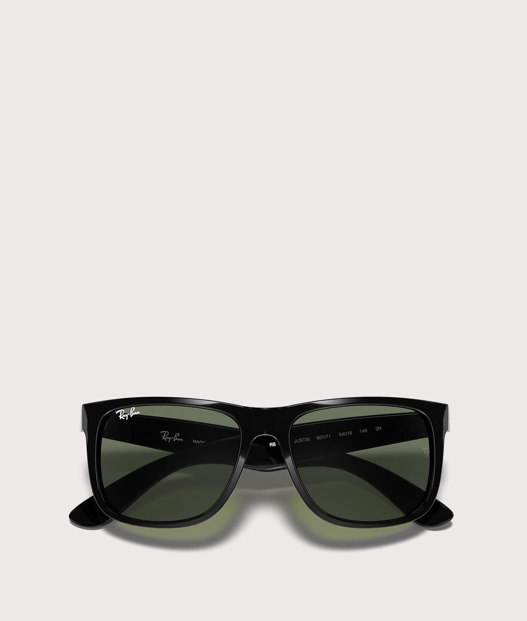Justin Classic Sunglasses in Polished Black Dark Green Lenses by Ray-Ban. Shot by EQVVS. Flat Shot.