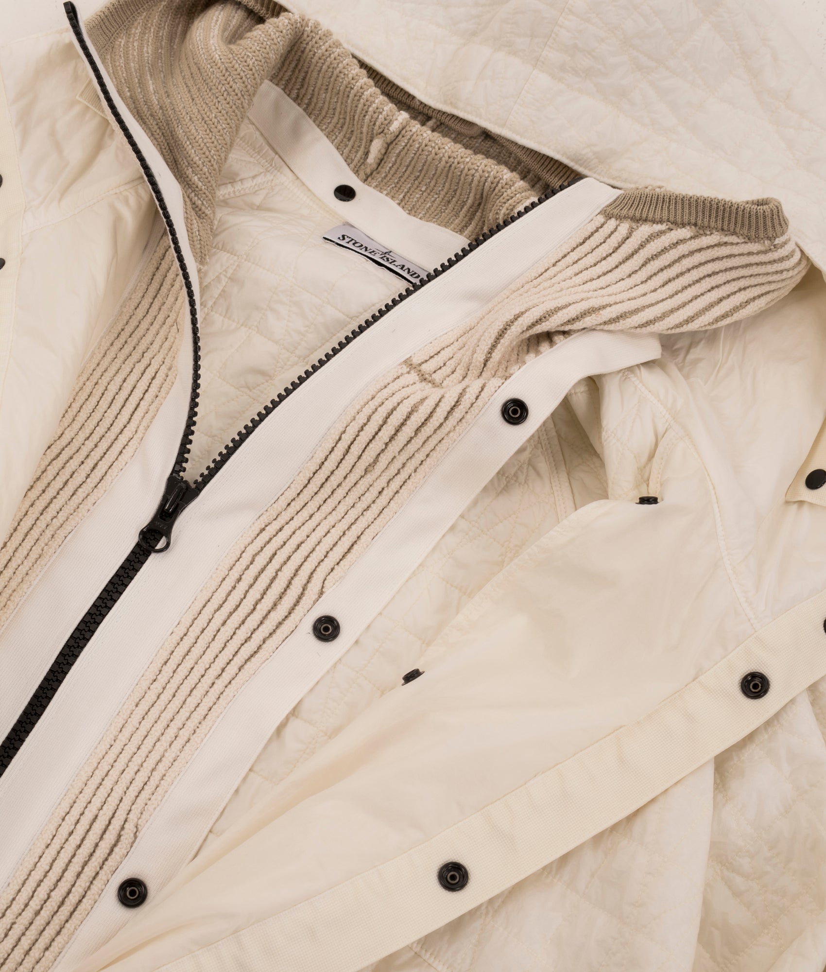 Stone Island Crinkles Reps NY Quilted-TC Jacket in Ivory at EQVVS Menswear. Front zip detail shot. 