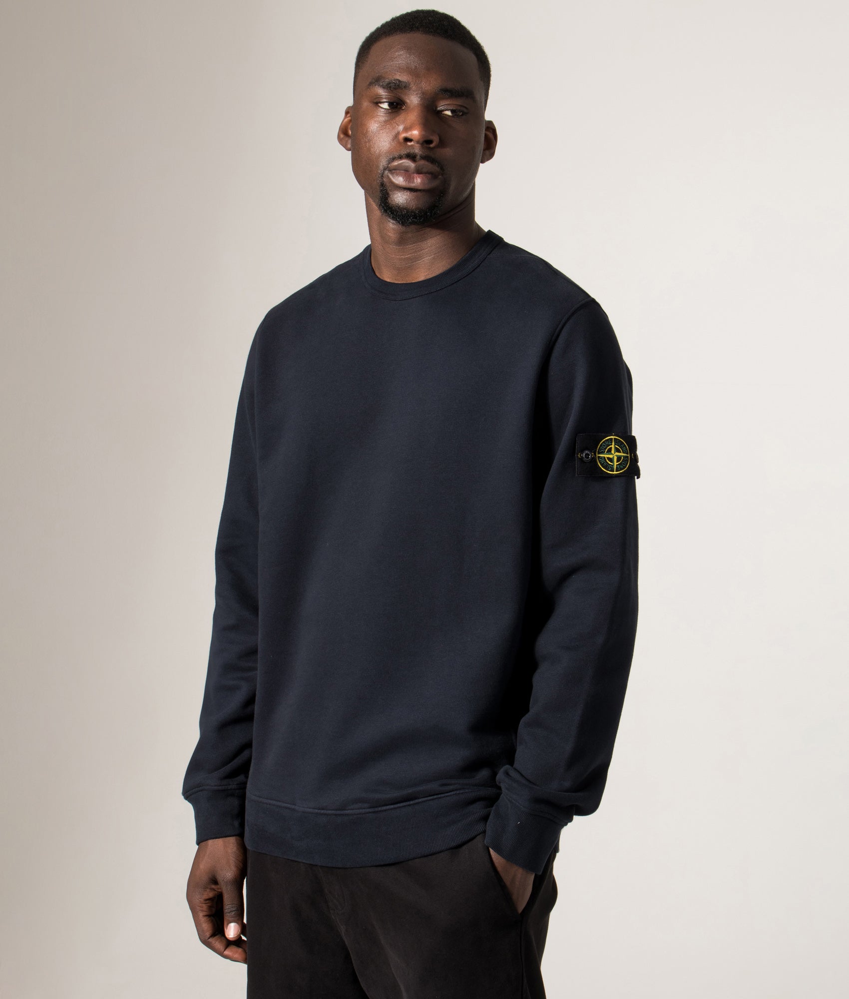 Brushed Organic Cotton Sweatshirt in Dark Navy. 100% Cotton | Stone Island | Shot at EQVVS | Front angle  model shot 