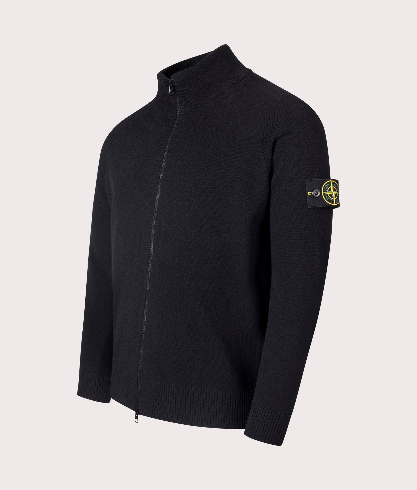 Stone Island Geelong Wool Zip Through Jumper in Black at EQVVS Menswear. Angled Front shot.