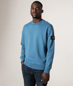 Organic Cotton Crewneck Sweatshirt in Steel Blue. 100% Cotton | Stone Island | Shot at EQVVS | Front angle model shot