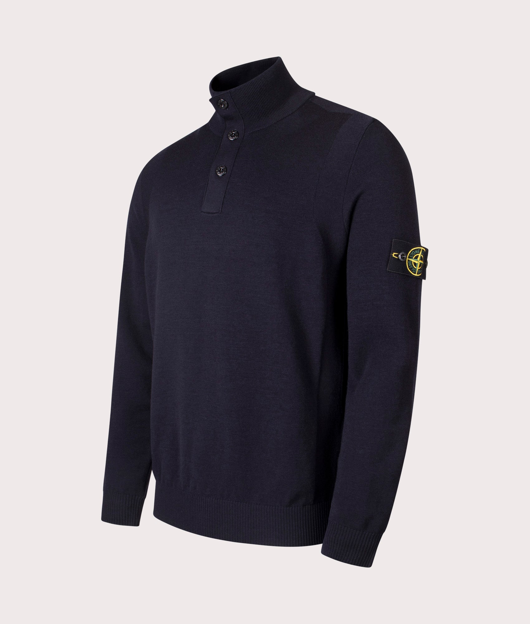 Stone Island Button Neck Reverse Stitch Jumper in Navy Blue at EQVVS Menswear. Angled front shot.