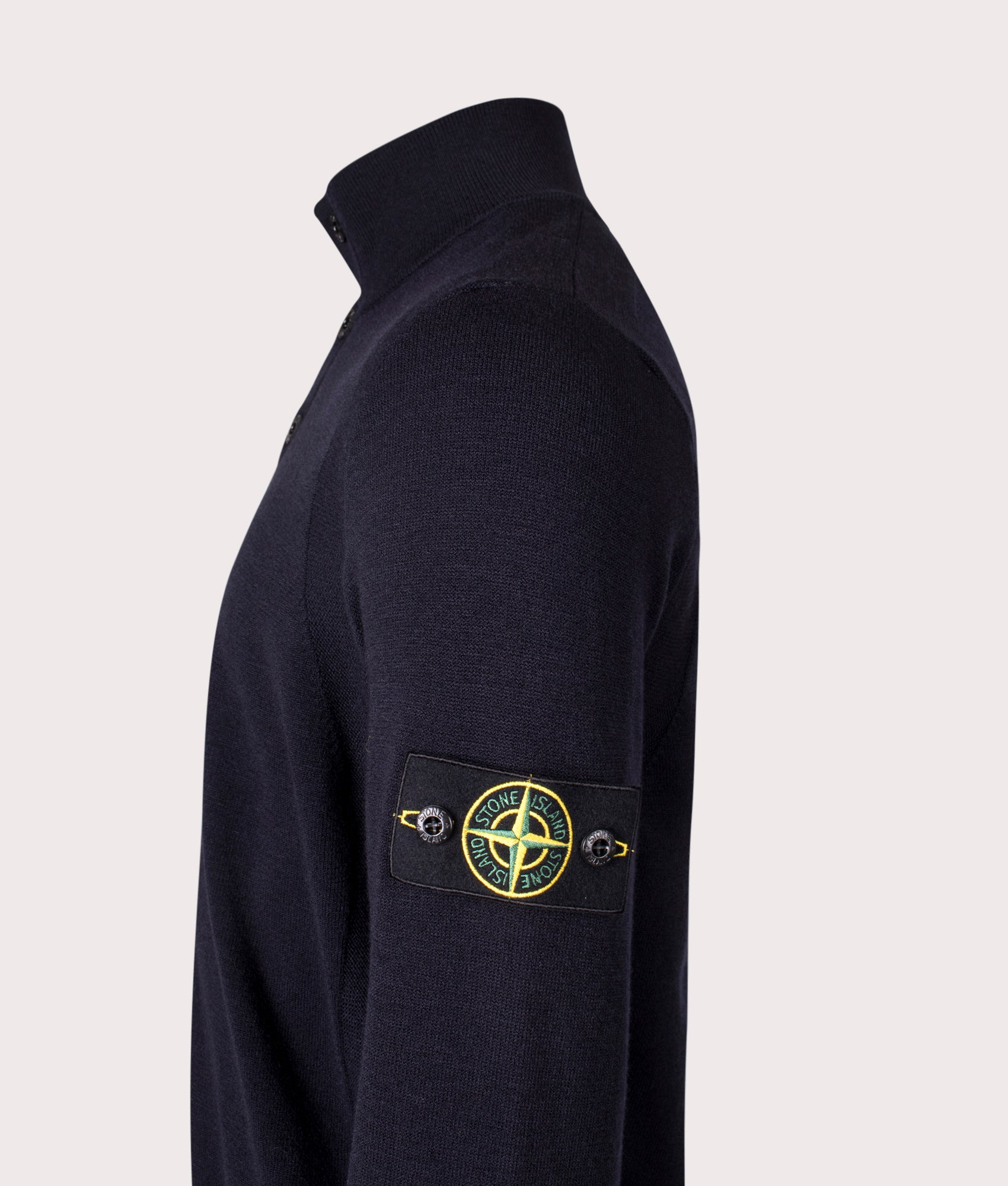 Stone Island Button Neck Reverse Stitch Jumper in Navy Blue at EQVVS Menswear. Side detail shot.