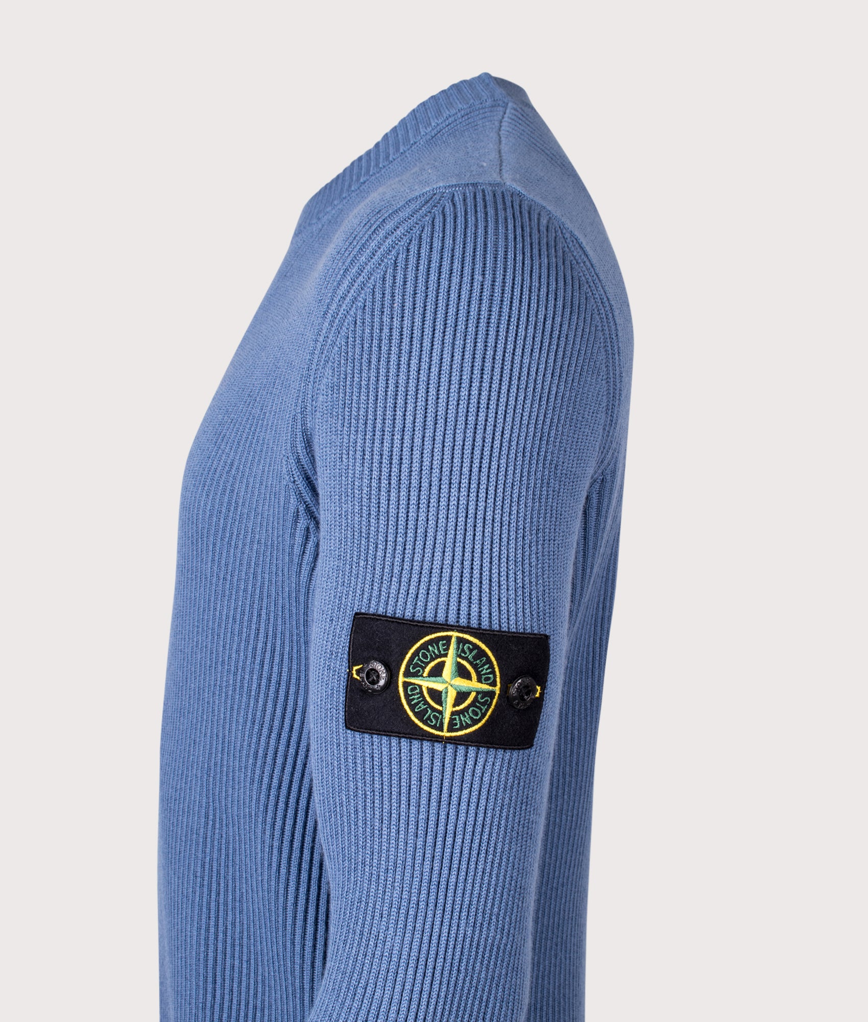 Crew Neck in Steel Blue. 100% Virgin Wool | Stone Island | Shot at EQVVS | Side detail shot