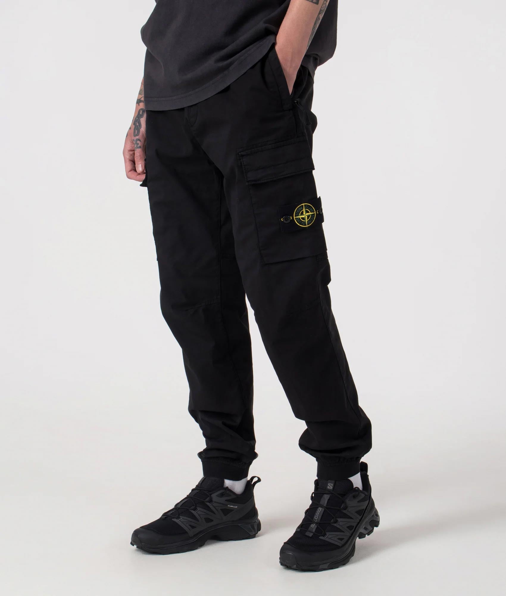 Regular Fit Tapered Cargo Trouser in Black | Cotton | Stone Island | EQVVS | Front angle shot