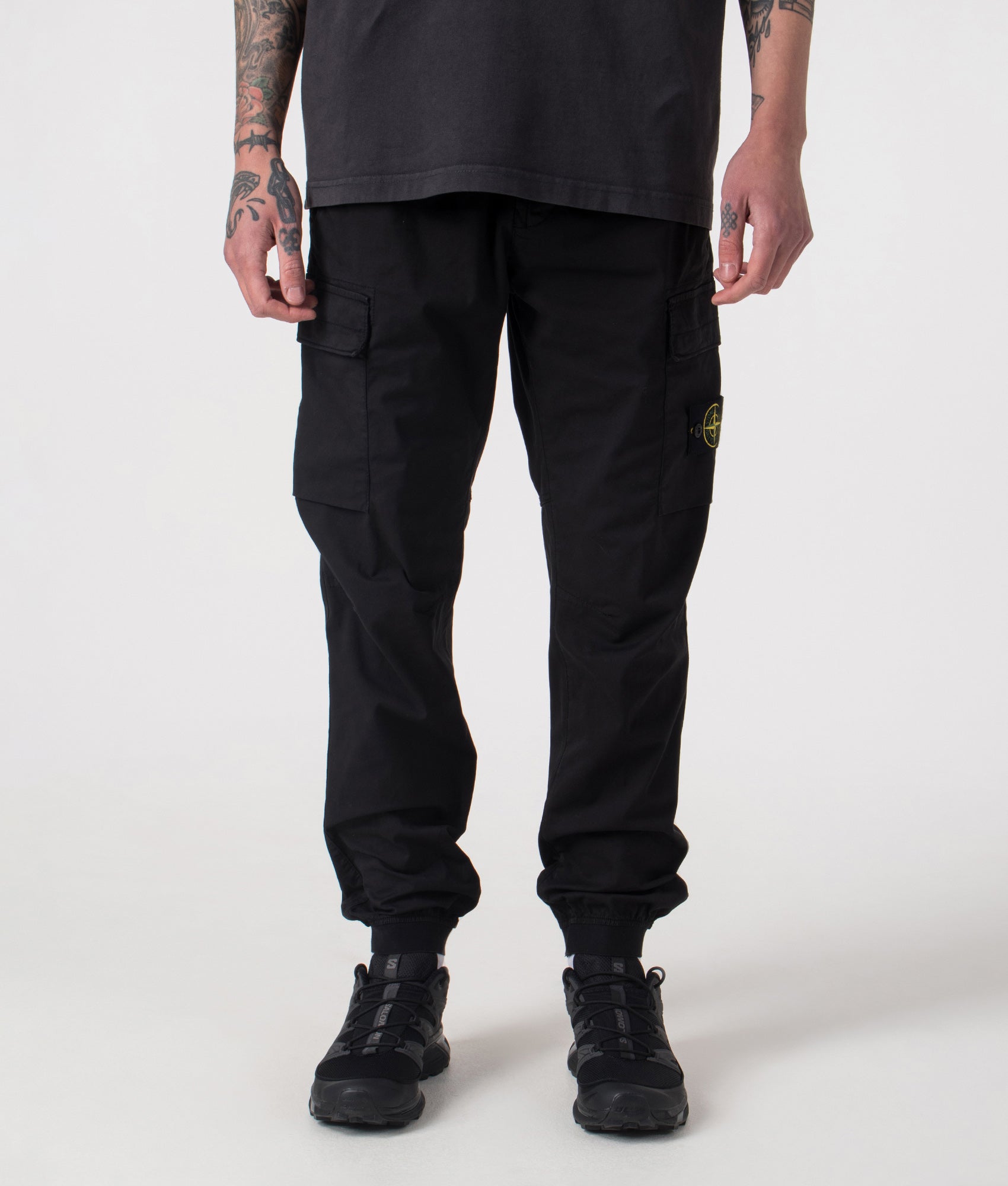 Regular Fit Tapered Cargo Trouser in Black | Cotton | Stone Island | EQVVS | Front shot 