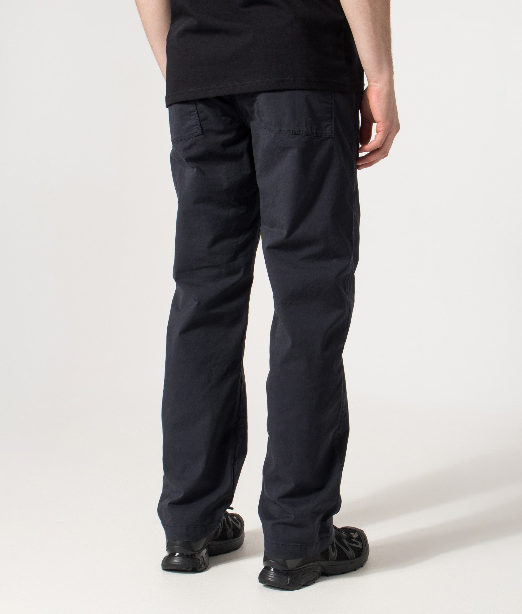 Stone Island Trousers in the Navy Blue at EQVVS Menswear. Back shot.