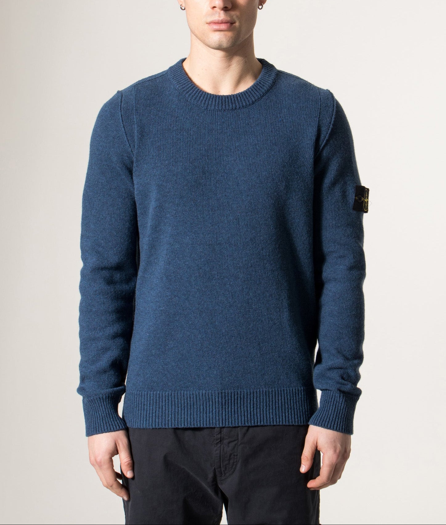 Stone Island Lambswool Crew Neck Jumper in Steel Blue at EQVVS Menswear. Model front shot.