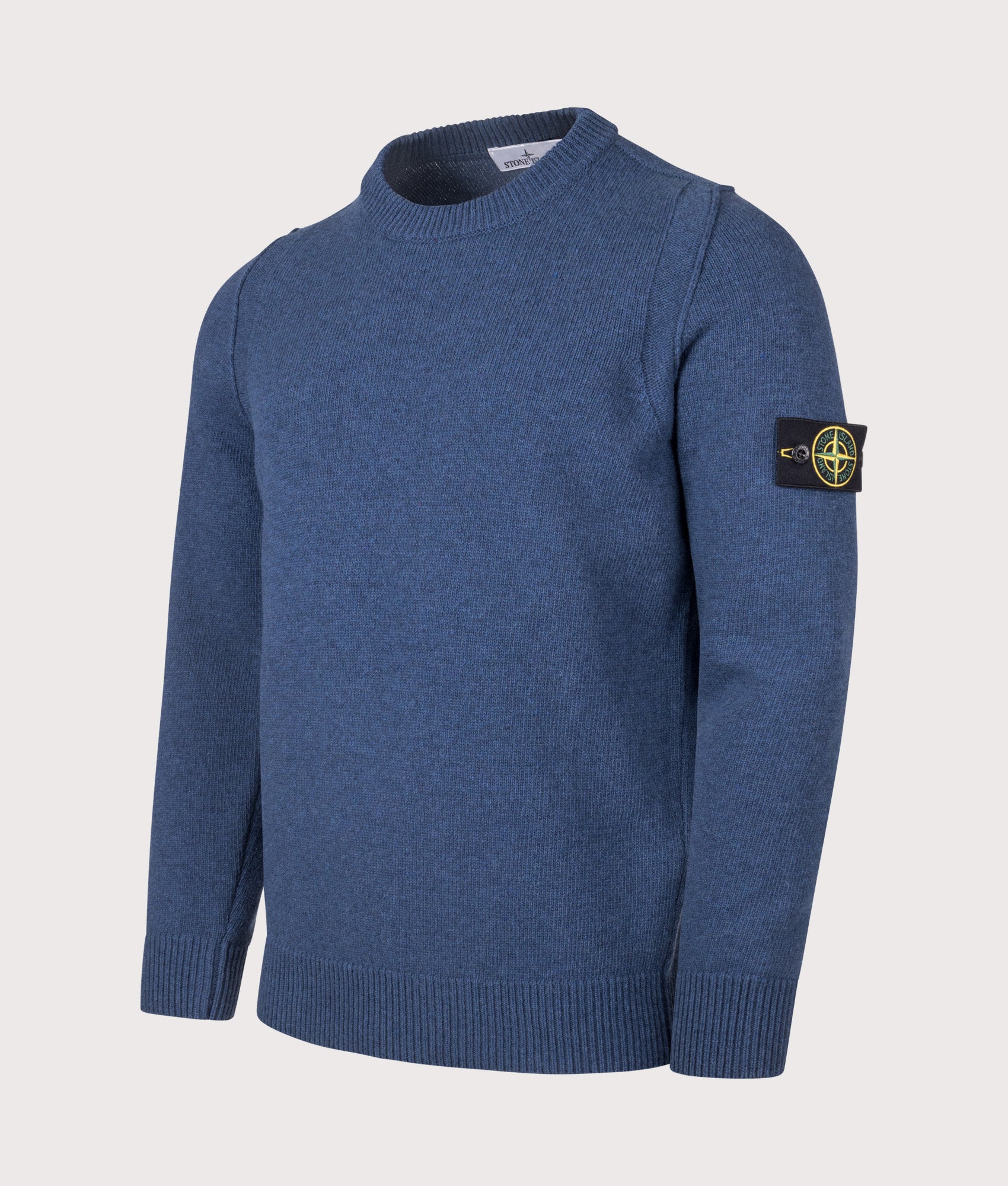 Stone Island Lambswool Crew Neck Jumper in Steel Blue at EQVVS Menswear. Front angled shot.