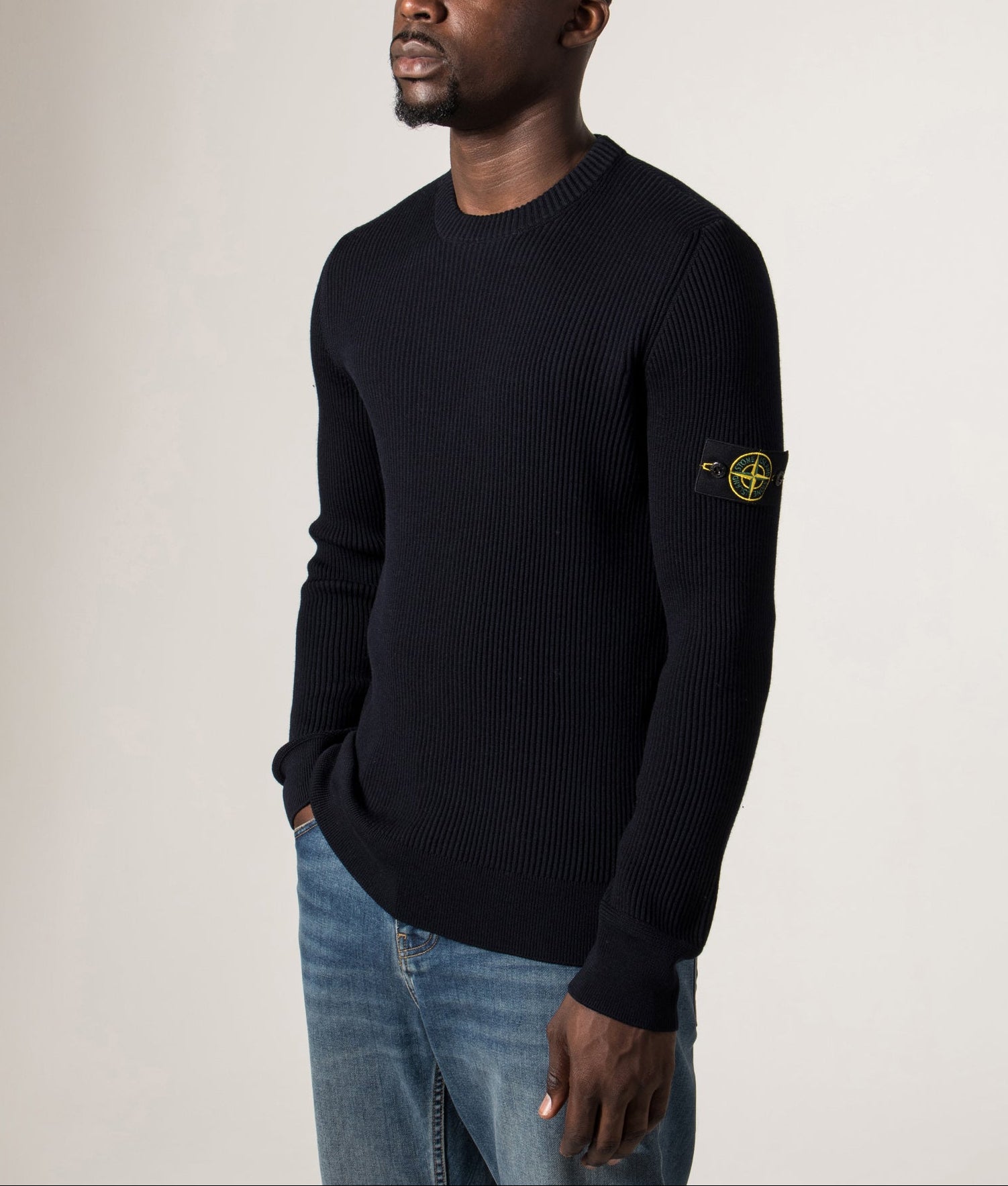 Wool Crew Neck Jumper in Navy Blue. 100% Virgin Wool | Stone Island | Shot at EQVVS | Front model angle shot 