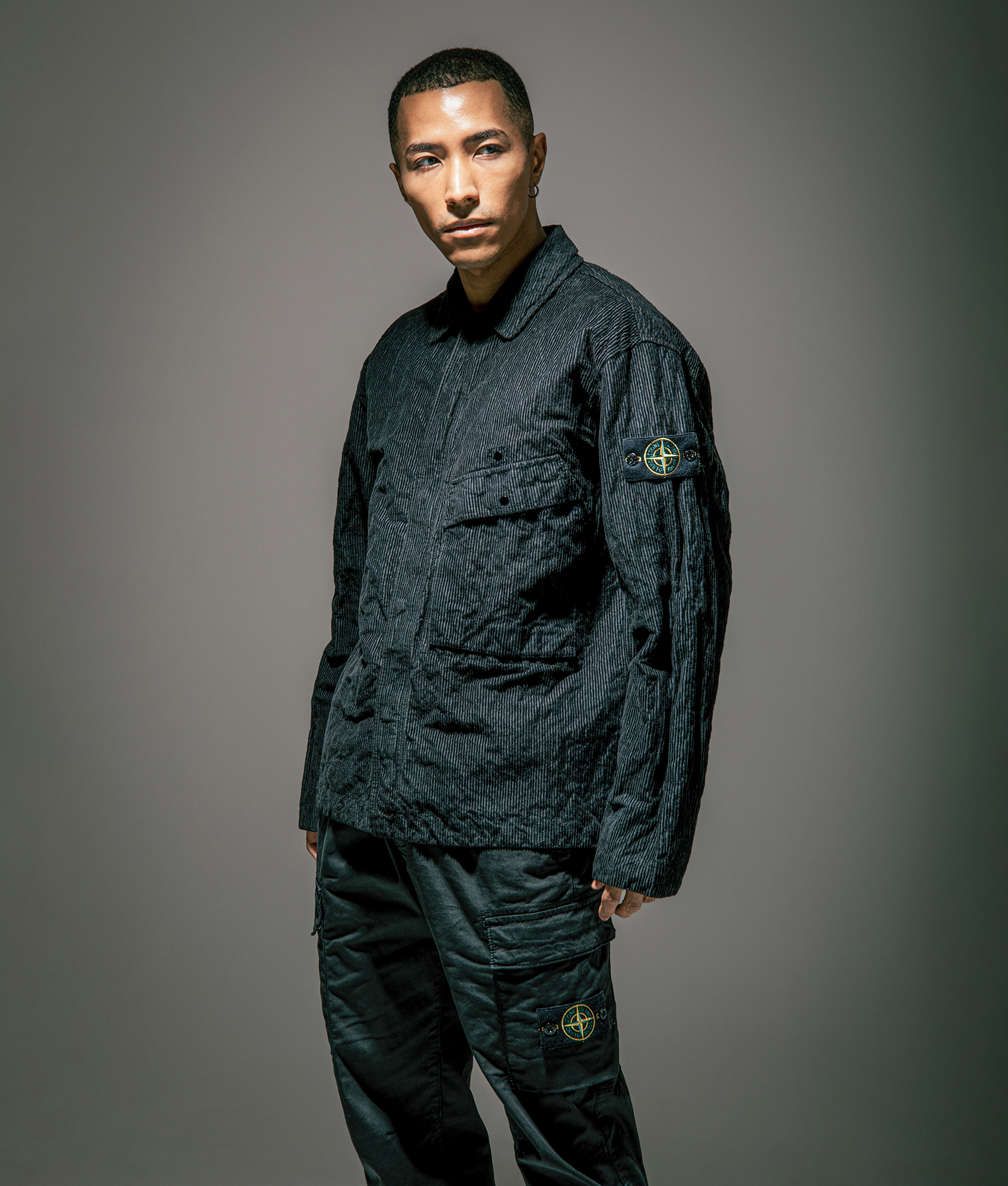 Stone Island Wrinkled Corduroy 500-TC Overshirt in Black at EQVVS Menswear. Campaign shot.