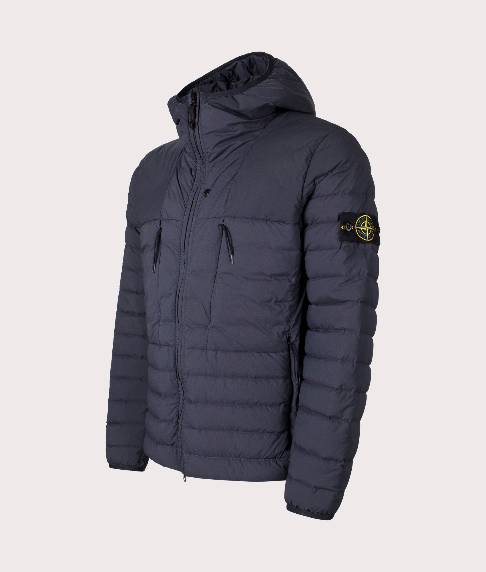 Stone Island Seamless Tunnel Nylon Down TC Jacket in Navy Blue at EQVVS Menswear. Angled front shot.