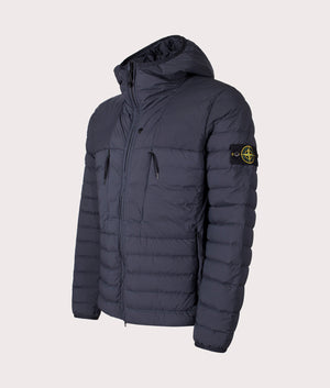 Stone Island Seamless Tunnel Nylon Down TC Jacket in Navy Blue at EQVVS Menswear. Angled front shot.