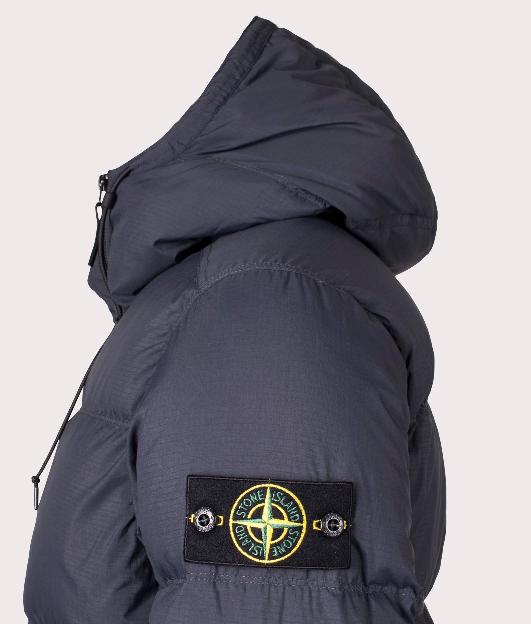 Stone Island Down Parka in Black at EQVVS Menswear. Side detail shot 