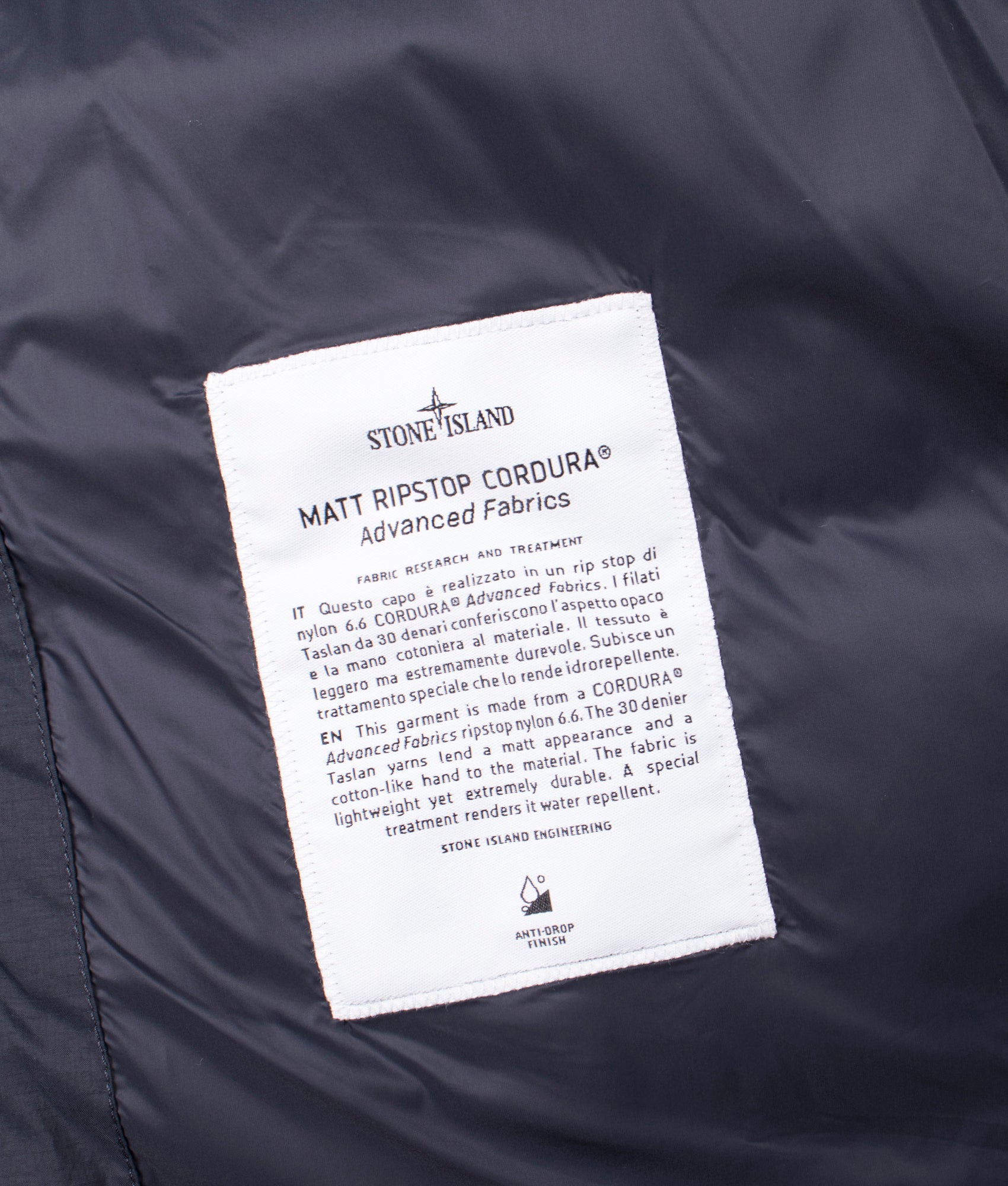Stone Island Down Parka in Black at EQVVS Menswear. Label shot 