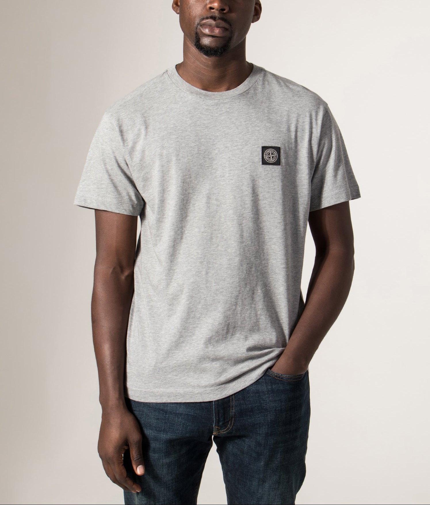 Slim Fit Patch Logo T-Shirt in Dark Grey . 100% Cotton | Stone Island | Shot at EQVVS | Front model shot 