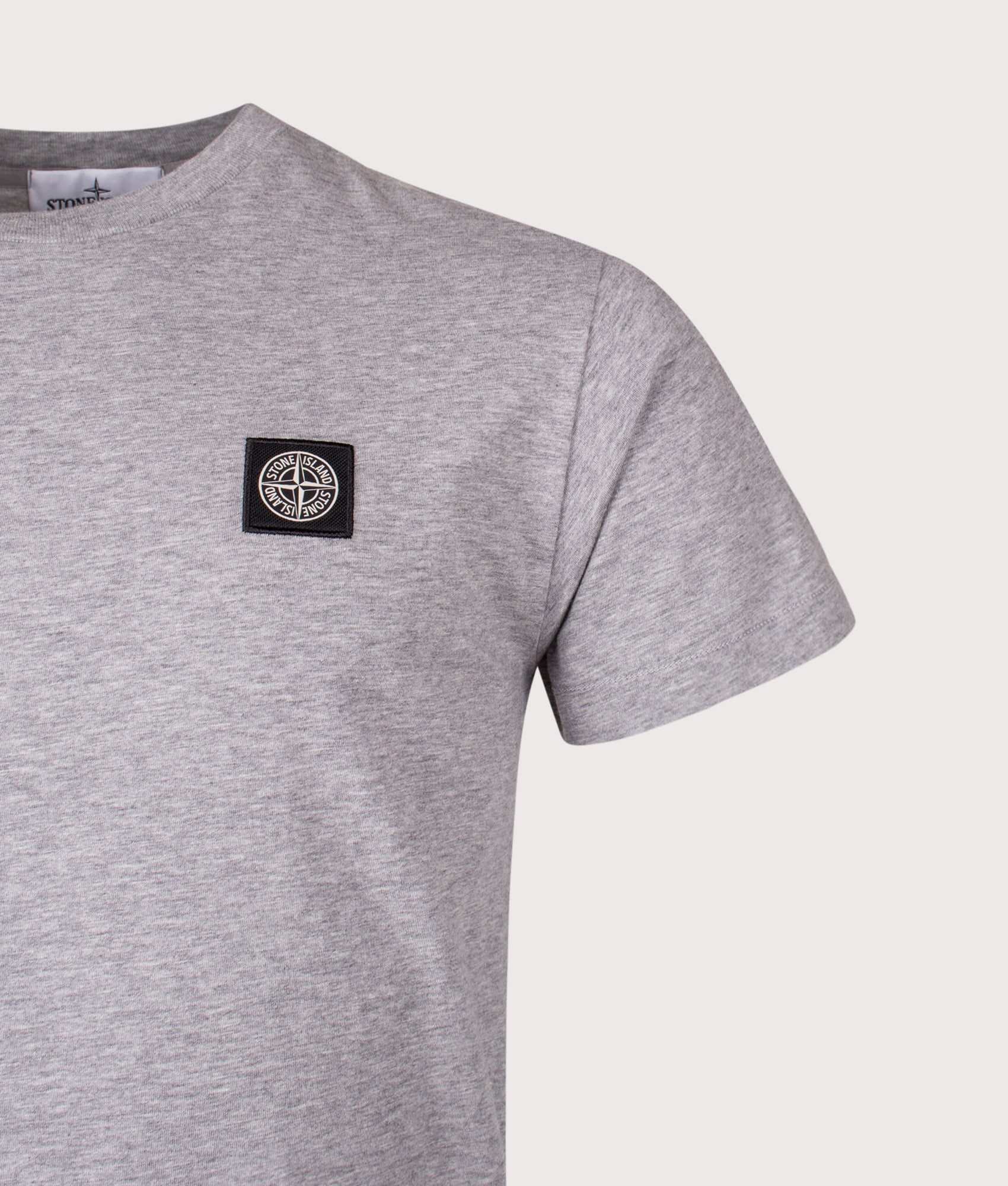 Slim Fit Patch Logo T-Shirt in Dark Grey . 100% Cotton | Stone Island | Shot at EQVVS | Front detail shot 