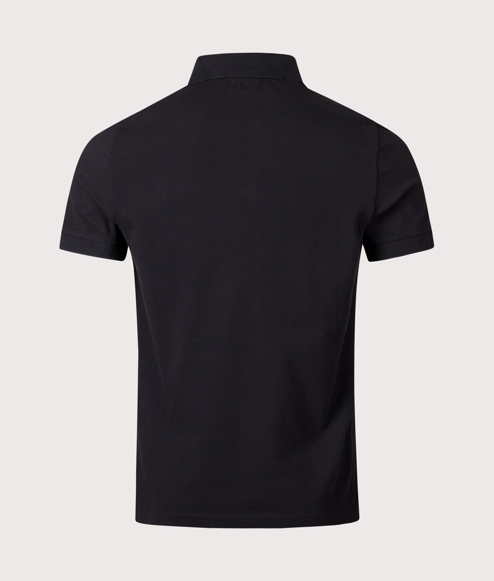 Stone Island Slim Fit Compass Patch Polo Shirt in Black at EQVVS Menswear. Back shot.