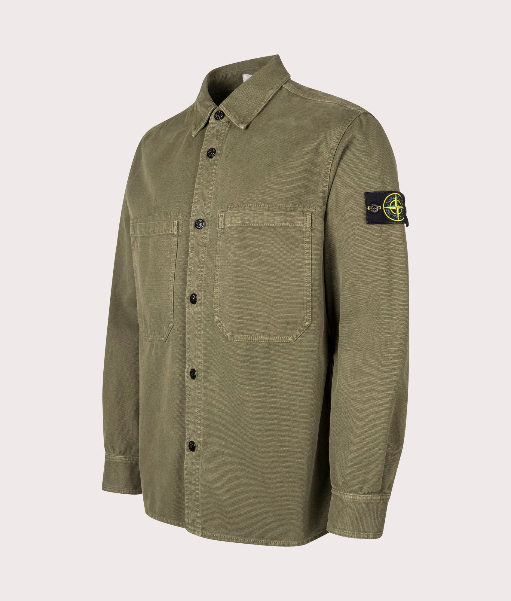 Stone Island Overshirt in Military Green at EQVVS Menswear. Angled front shot.