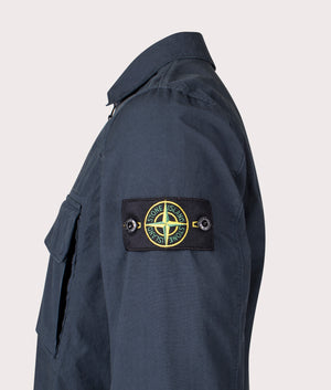 Canvas Weave Overshirt in Navy Blue . 100% Cotton | Stone Island | Shot at EQVVS | Side detail shot 
