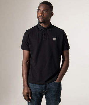 Slim Fit Compass Patch Polo Shirt in Black. Cotton-blend | Stone Island | Shot at EQVVS | Front model shot 