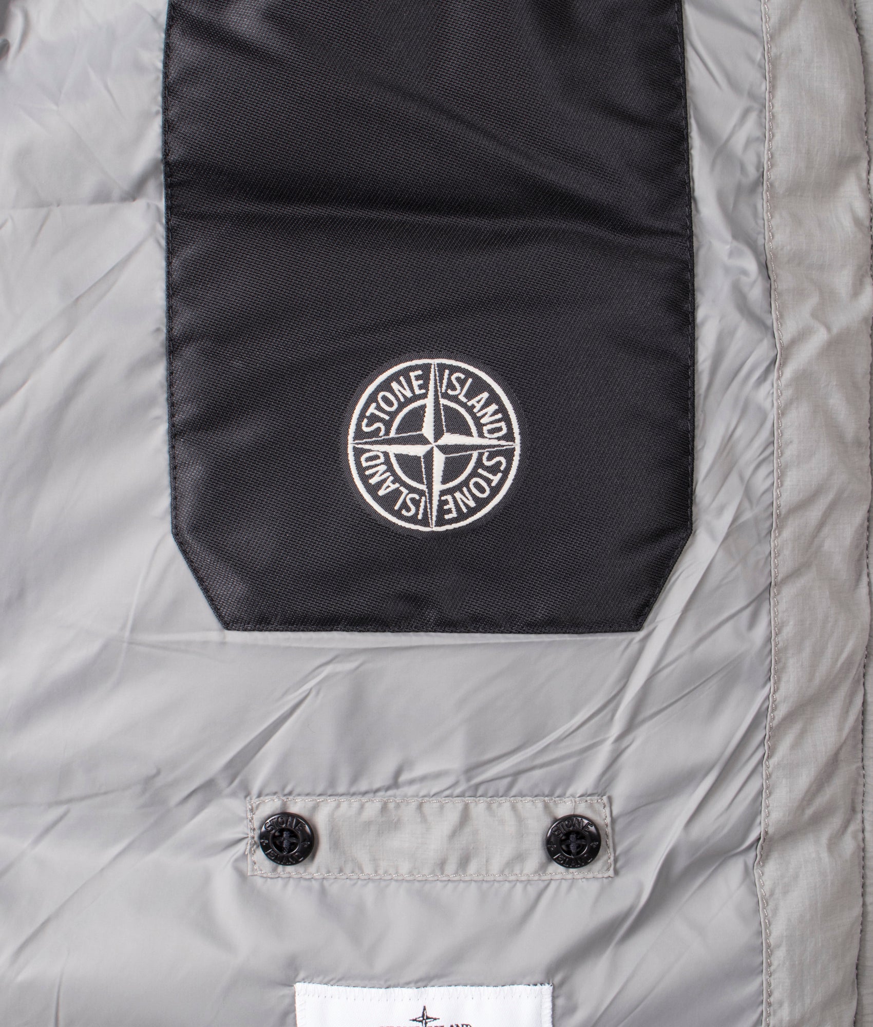 Down Parka in Cement | RDS Down | Stone Island | EQVVS | Inside branding shot 