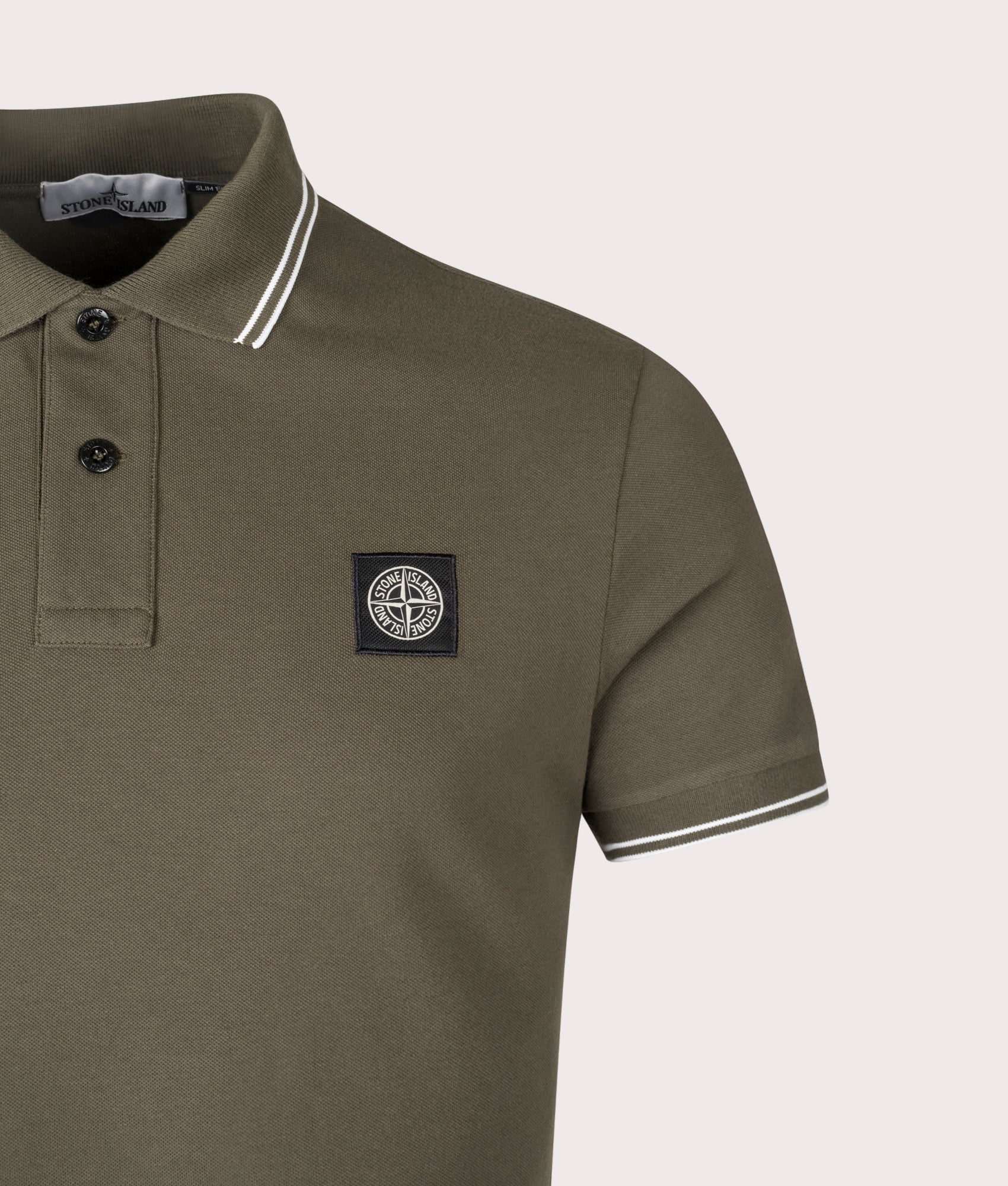 Stone Island Slim Fit Striped Collar Polo Shirt in Military Green at EQVVS Menswear. Detail shot.