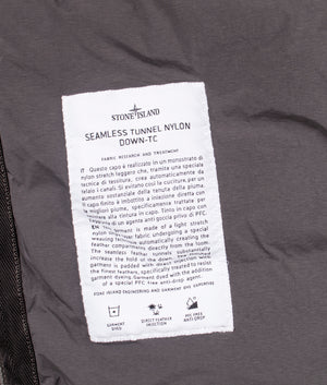 Stone Island Seamless Tunnel Nylon Down TC Jacket in Lead Grey at EQVVS Menswear. Label detail shot.