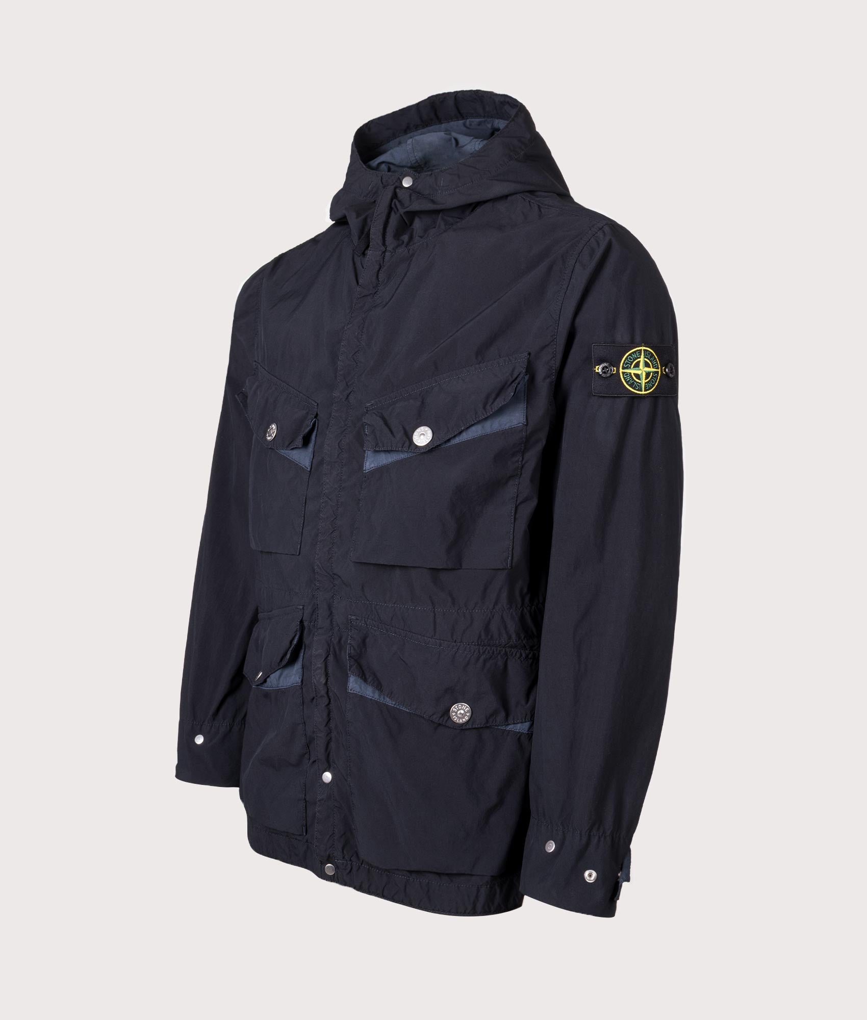Light Compact Field Parka by Stone Island in Navy Blue. Shot by EQVVS. Front detail shot.