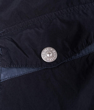 Light Compact Field Parka by Stone Island in Navy Blue. Shot by EQVVS. Detail button shot.