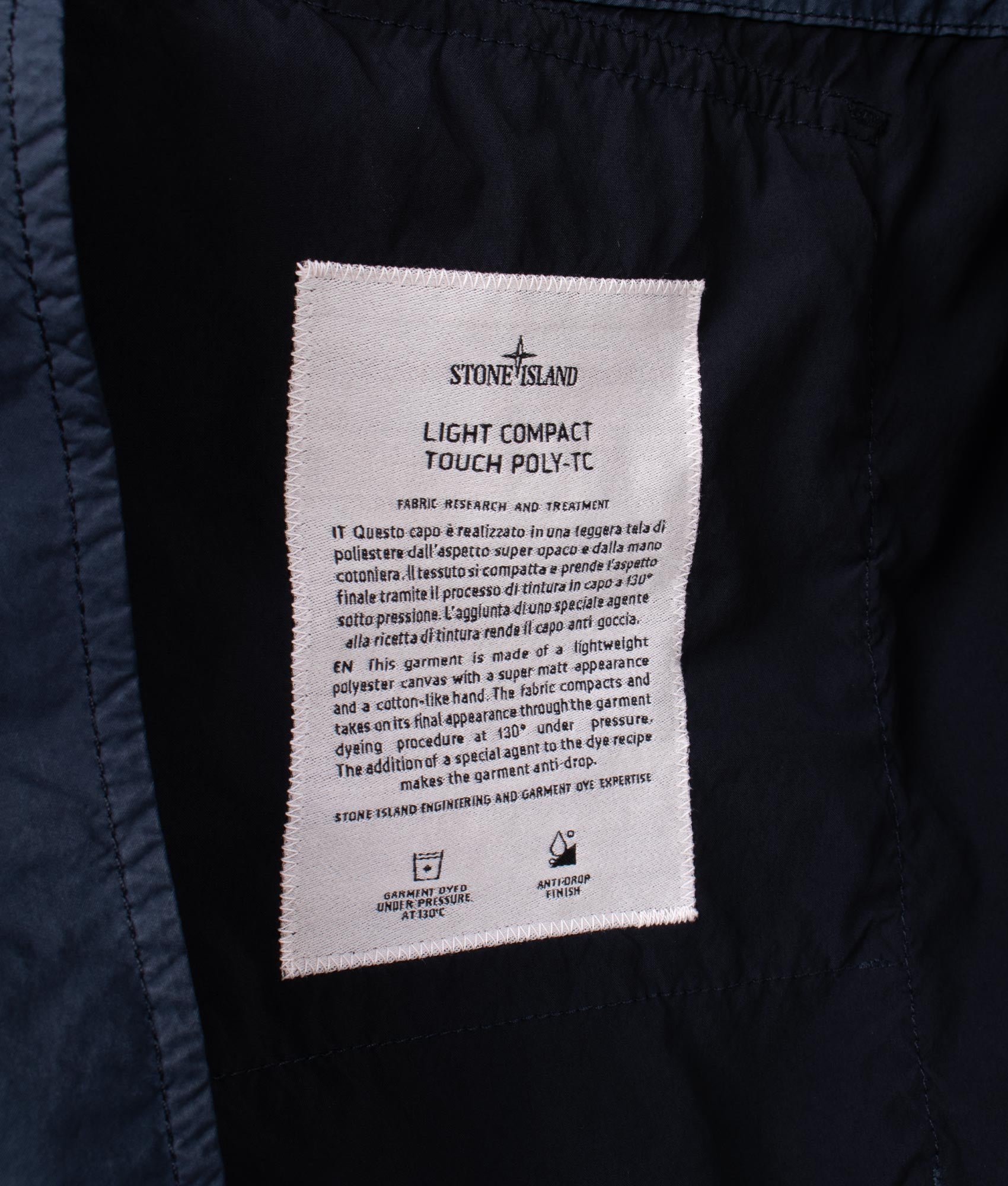 Light Compact Field Parka by Stone Island in Navy Blue. Shot by EQVVS. Detail internal shot.