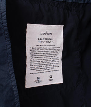 Light Compact Field Parka by Stone Island in Navy Blue. Shot by EQVVS. Detail internal shot.