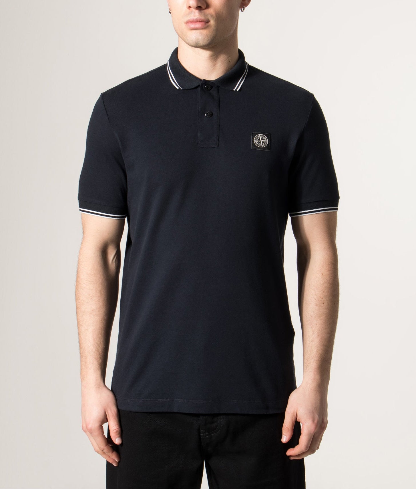 Stone Island Slim Fit Striped Collar Polo Shirt in Navy Blue at EQVVS Menswear. Model front shot.