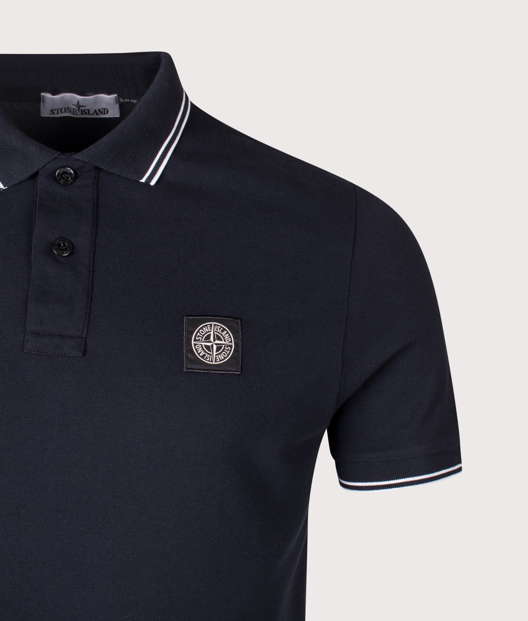 Stone Island Slim Fit Striped Collar Polo Shirt in Navy Blue at EQVVS Menswear. Detail shot.