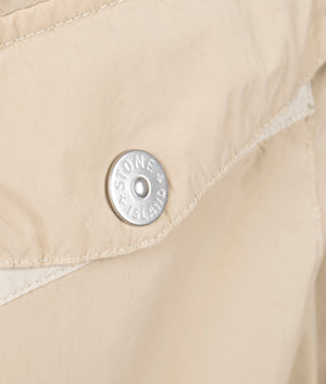 Light Compact Field Jacket by Stone Island in Desert. Shot by EQVVS. Brading detail shot.