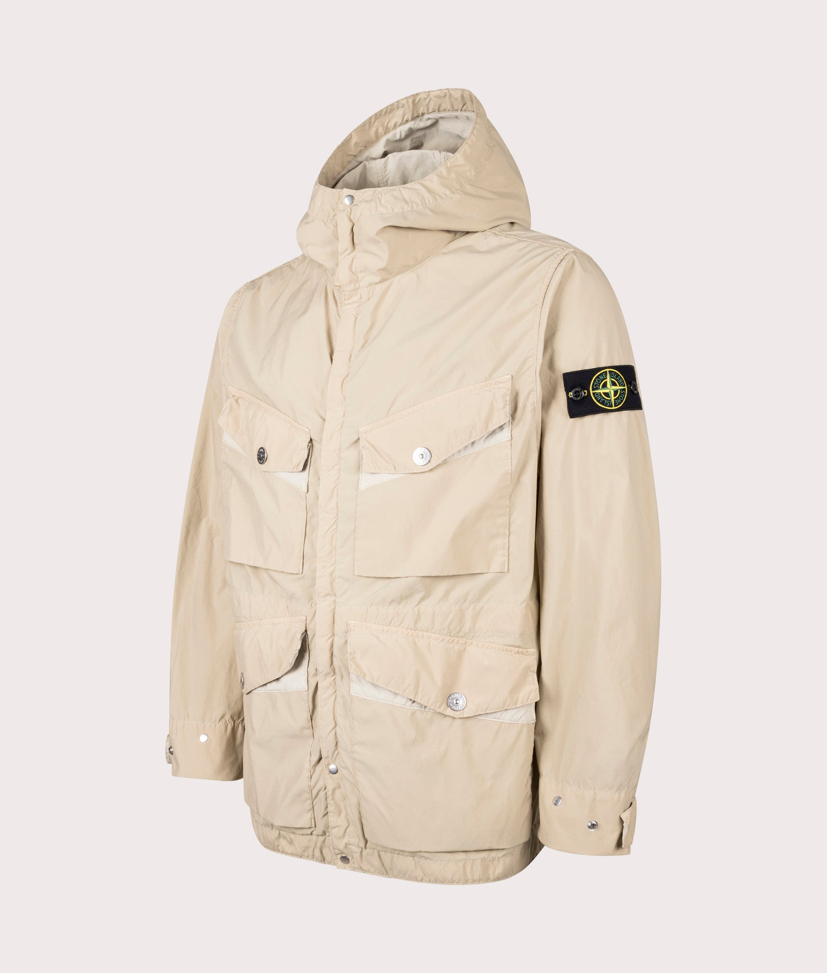 Light Compact Field Jacket by Stone Island in Desert. Shot by EQVVS. Front detail shot.