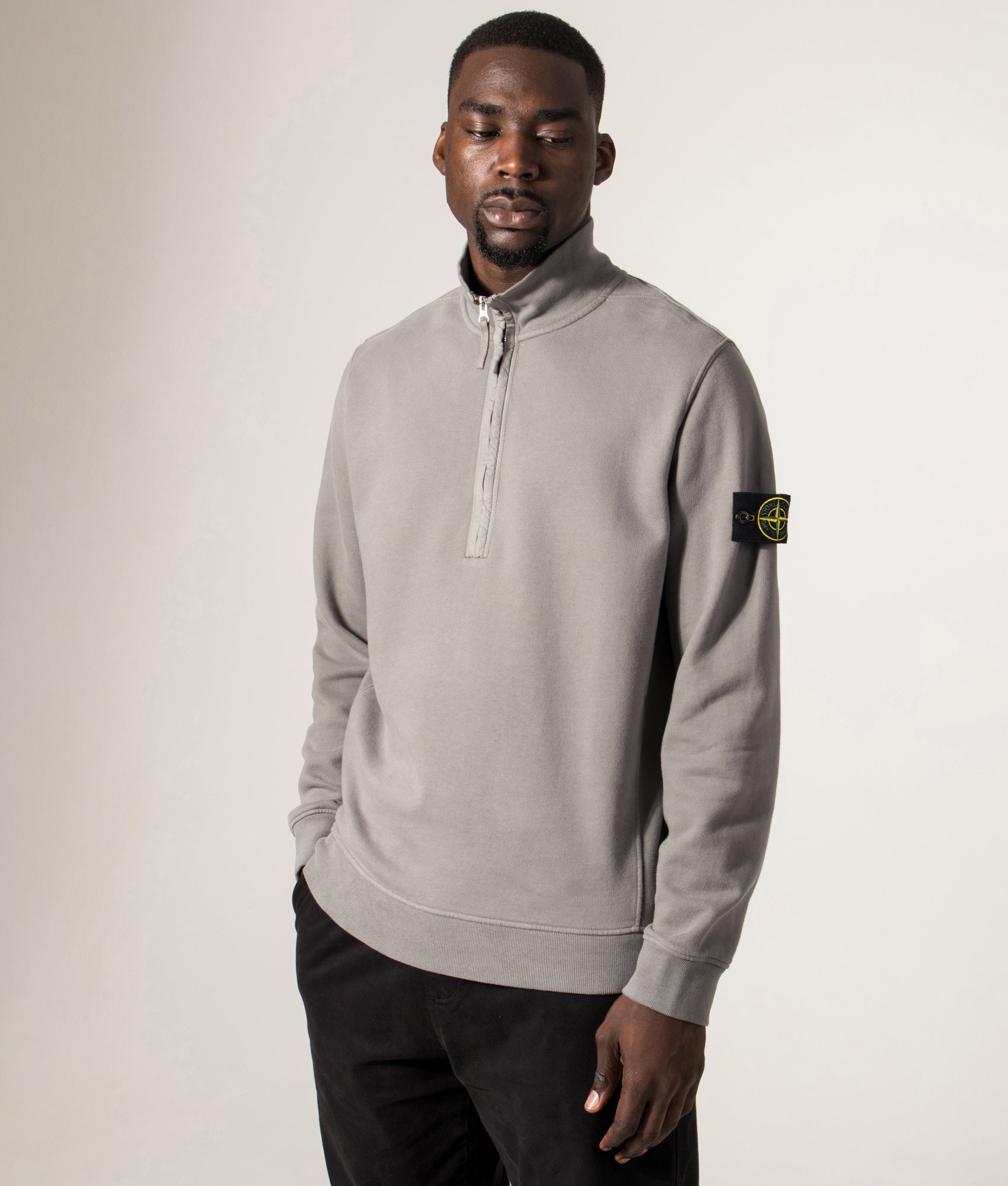 Organic Cotton Quarter Zip in Cement . 100% Organic Cotton | Stone Island | Shot at EQVVS | Front angle model shot 